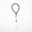 Buy agarwood prayer beads with a white tassel displayed on a white background