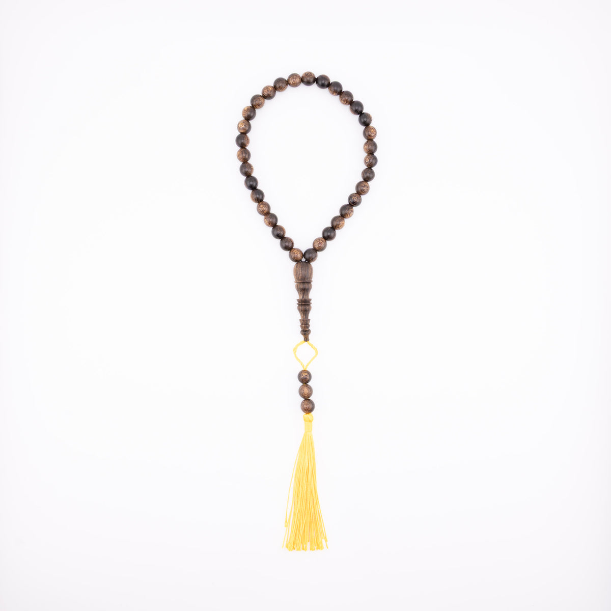 Buy agarwood prayer beads with a yellow tassel displayed on a white background