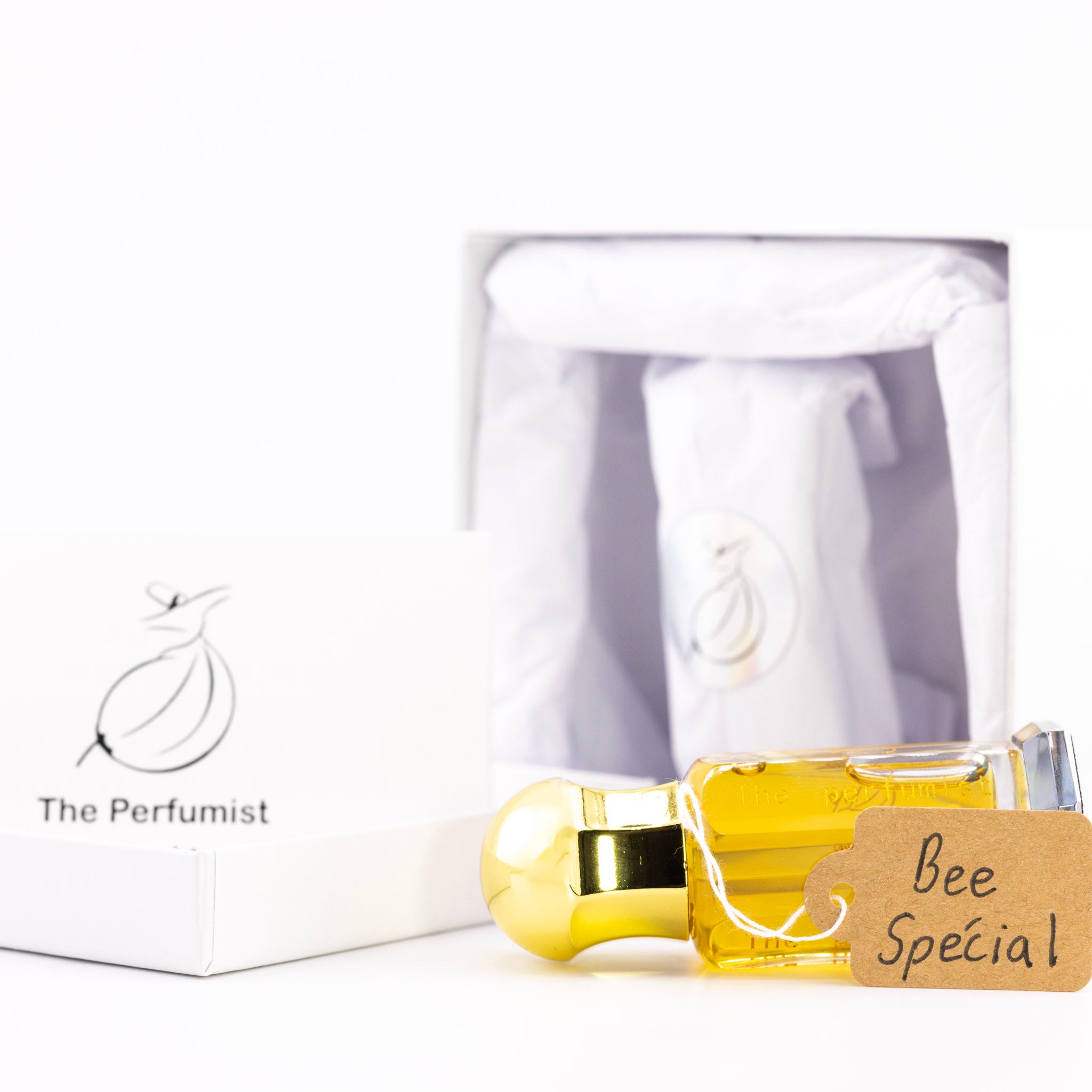 Perfume bottle with gold cap and 'Bee Special' label on a white background, featuring 'The Perfumist' brand.