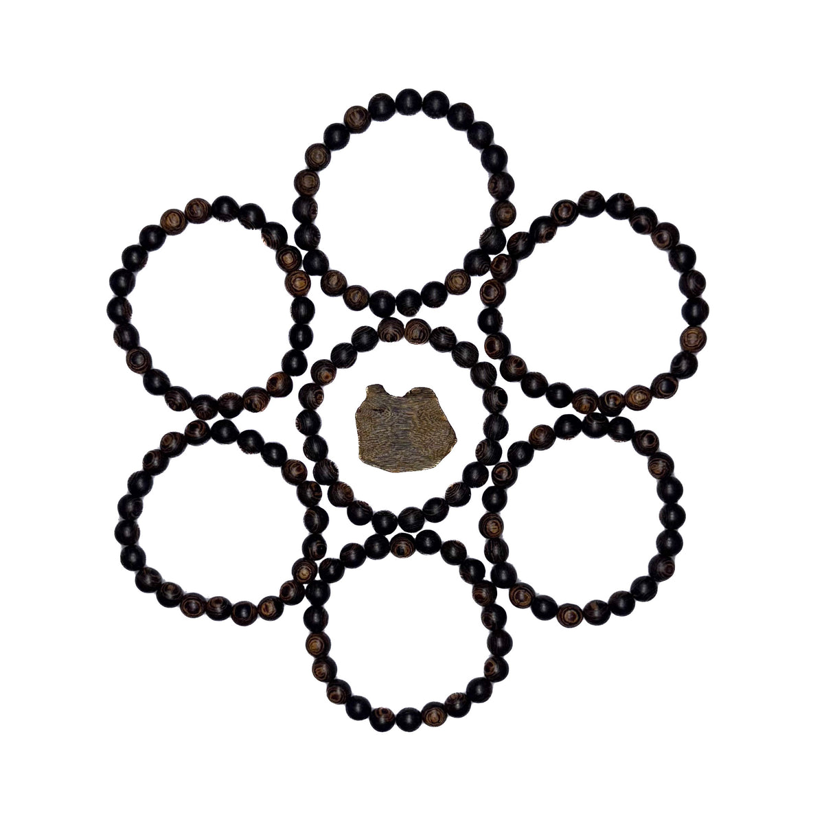 Authentic agarwood bracelet online collection arranged around pieces of raw agarwood