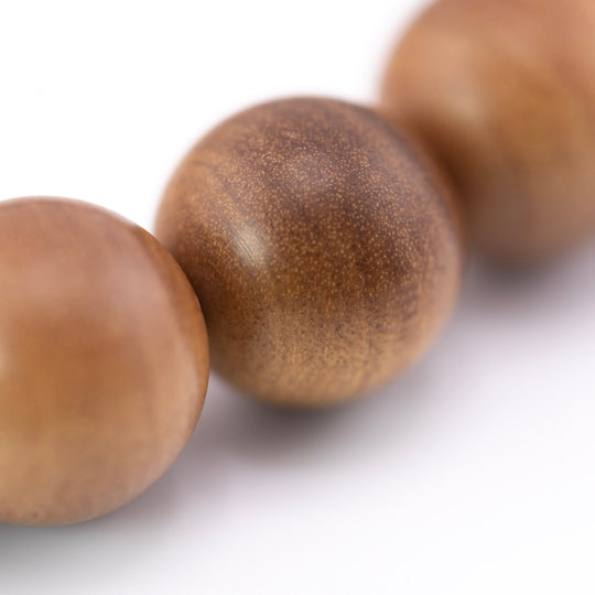 Buy natural sandalwood bracelet shown close up with fine Mysore wood grain