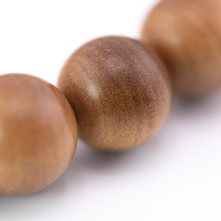 Buy natural sandalwood bracelet shown close up with fine Mysore wood grain