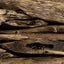 Close-up of dark resin patterns in natural agarwood chips